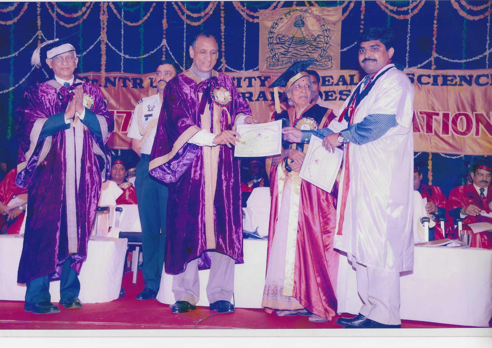 Receiving Gold medal from Governor of AP
